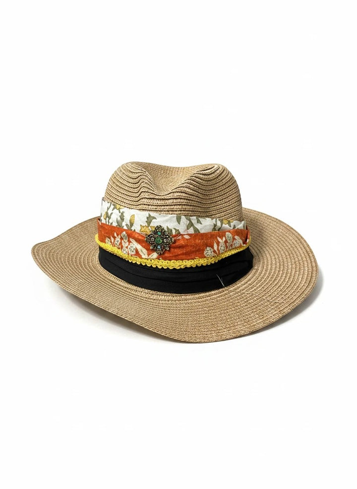 Adams + Hegwood straw fedora hat with a multi-layered floral fabric band, yellow trim, and vintage-style brooch.