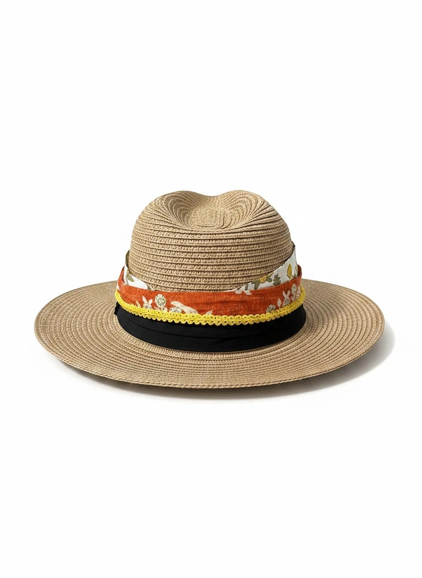 Adams + Hegwood straw fedora hat with a layered floral fabric band, yellow trim, and black ribbon on white background