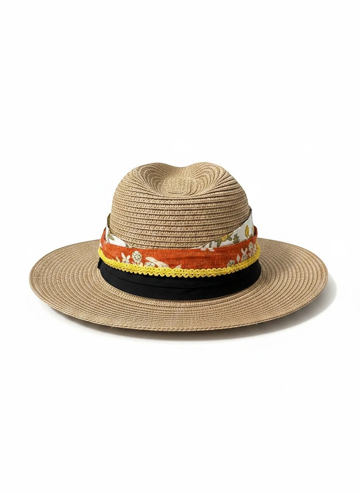 Adams + Hegwood straw fedora hat with a layered floral fabric band, yellow trim, and black ribbon on white background