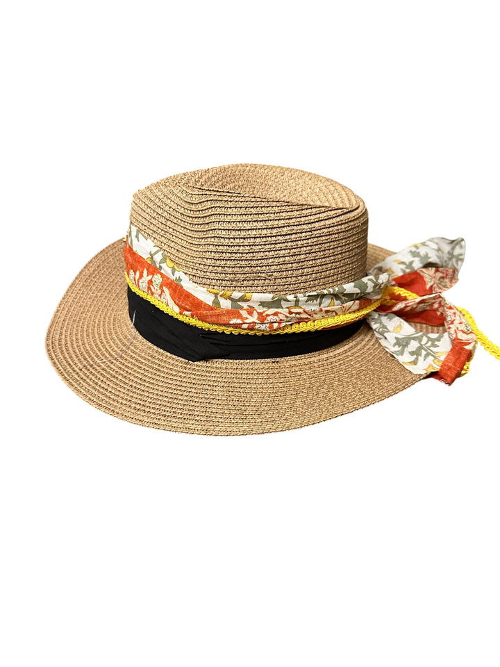 Adams + Hegwood straw fedora hat with a decorative floral fabric band, yellow trim, and black ribbon accent.