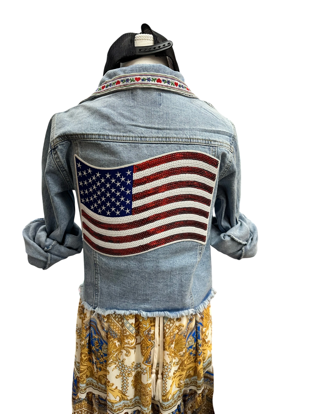 Adams + Hegwood light-wash denim jacket with American flag sequin patch on back and embroidered collar.