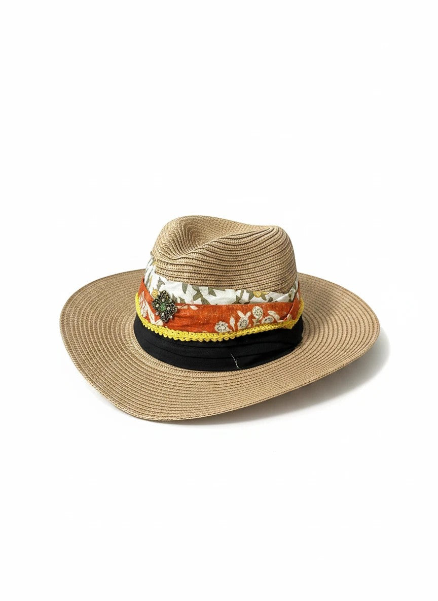 Adams + Hegwood straw fedora hat with a multi-layered floral fabric band, yellow trim, and vintage-style brooch.