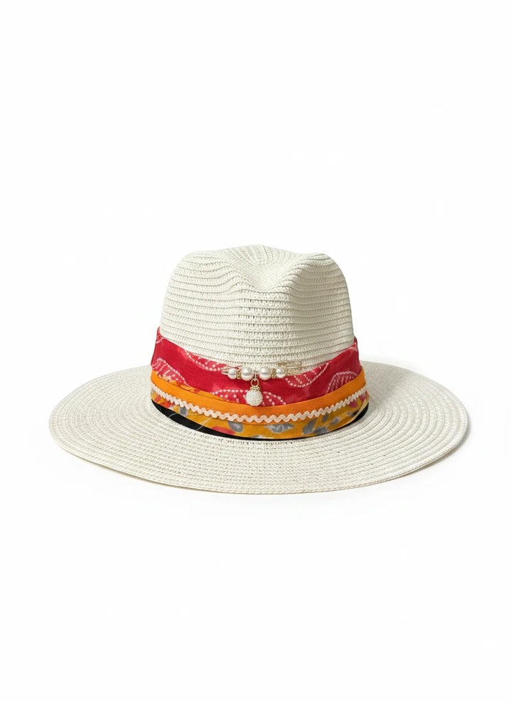 Adams + Hegwood white straw fedora hat with a colorful patterned fabric band, pearl accents, and a charm detail.