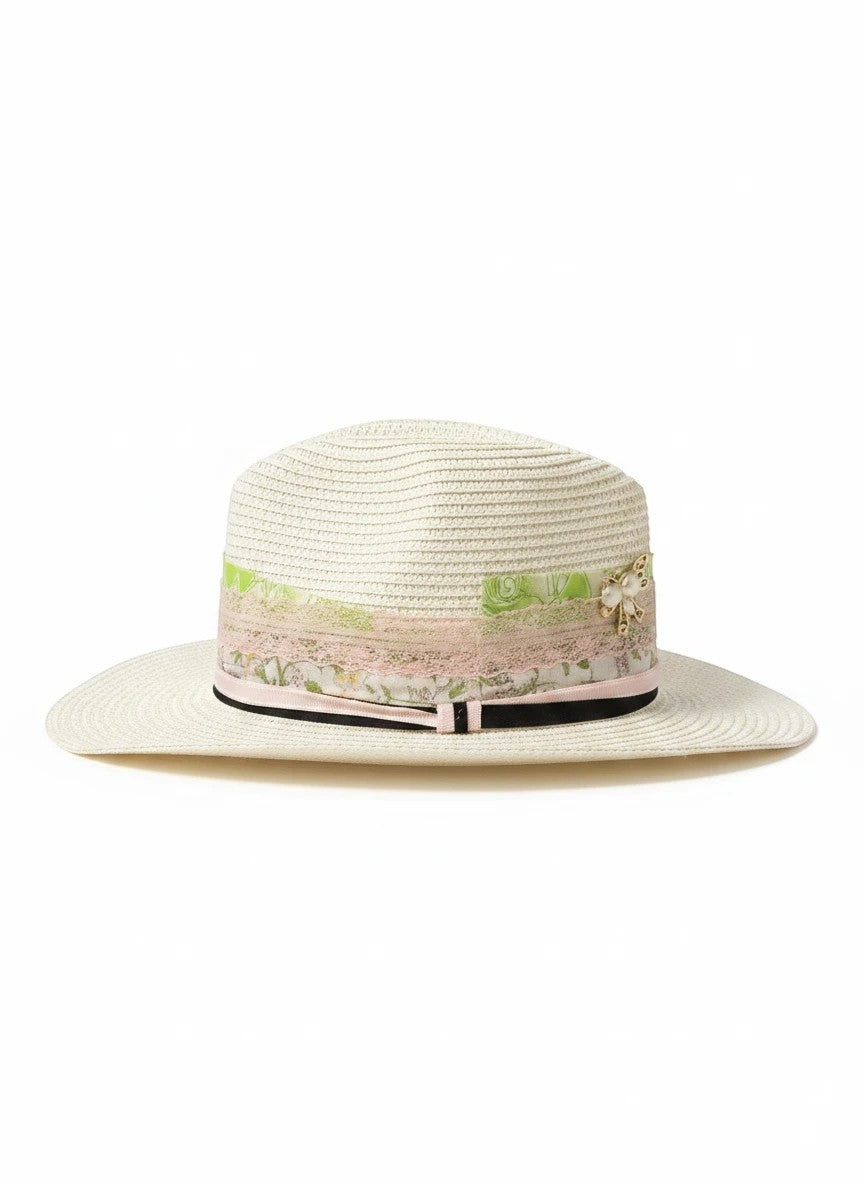 Adams + Hegwood off-white straw fedora with a layered floral ribbon, lace band, and pearl-accented bow detail.