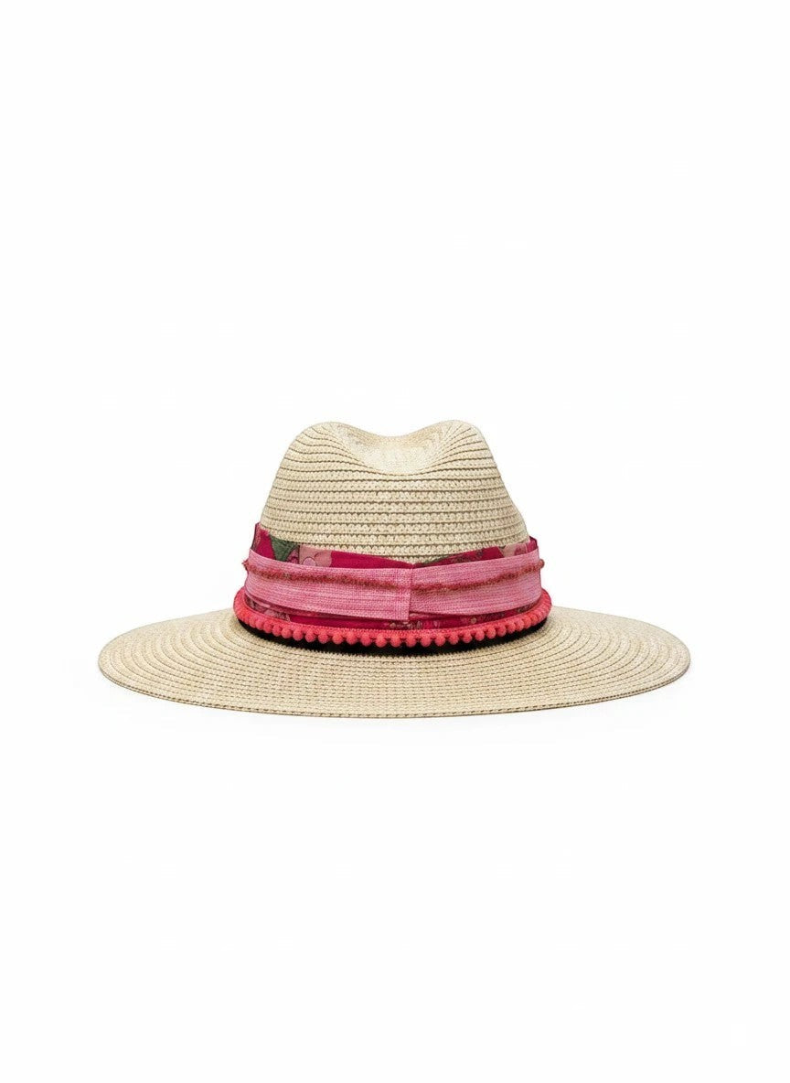 Adams + Hegwood natural straw fedora hat with pink floral band and pom-pom trim.