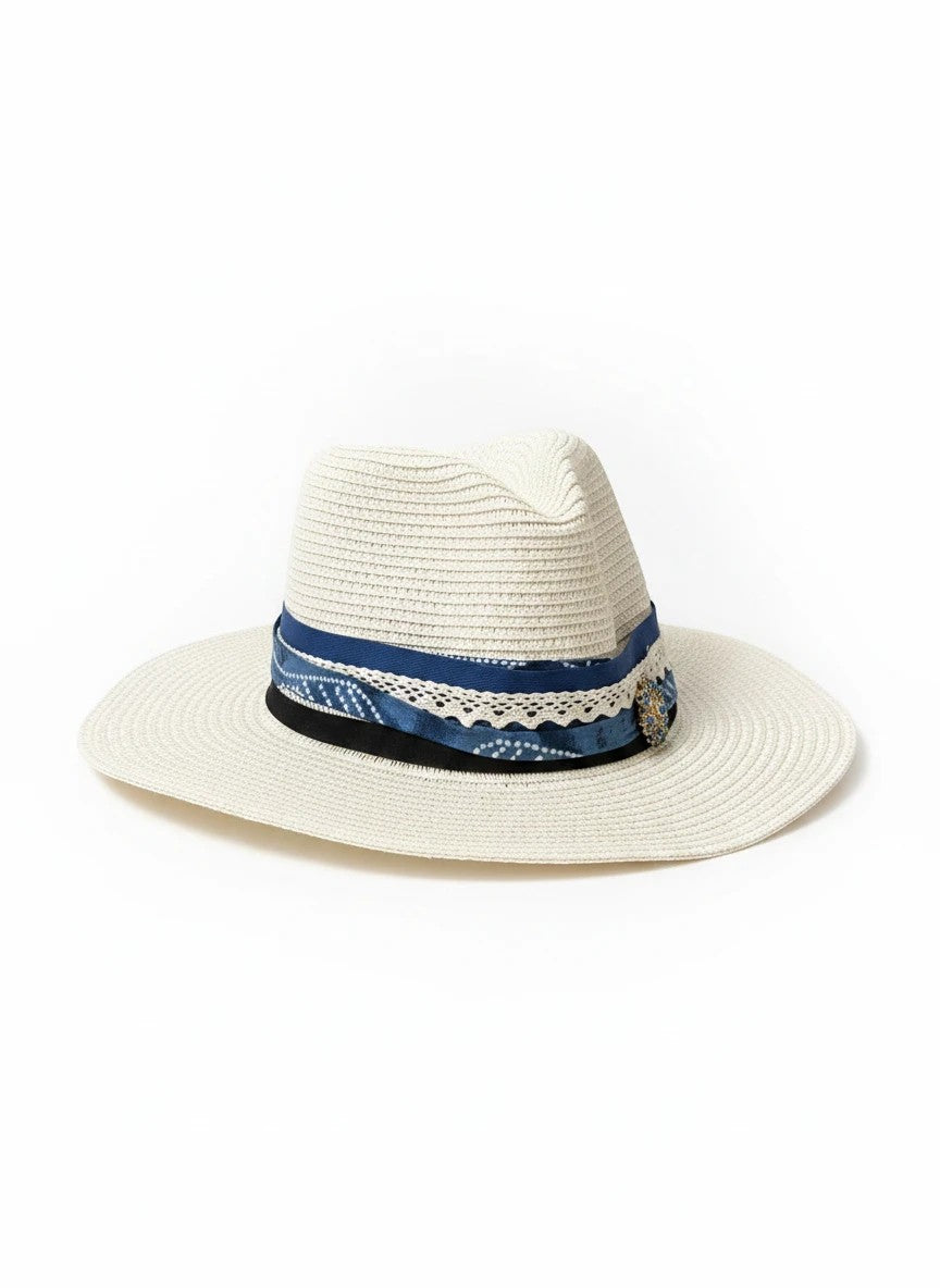 Adams + Hegwood woven straw fedora with a blue patterned fabric band, white lace trim, and elegant side embellishment.
