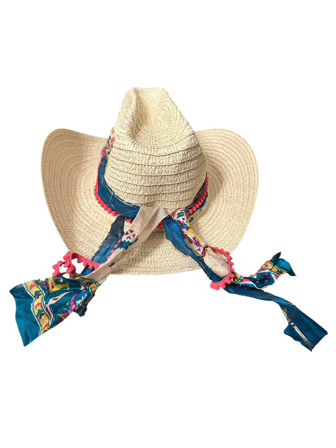 Adams + Hegwood woven straw Western hat with blue patterned fabric band, pink pom-poms, and bohemian style.