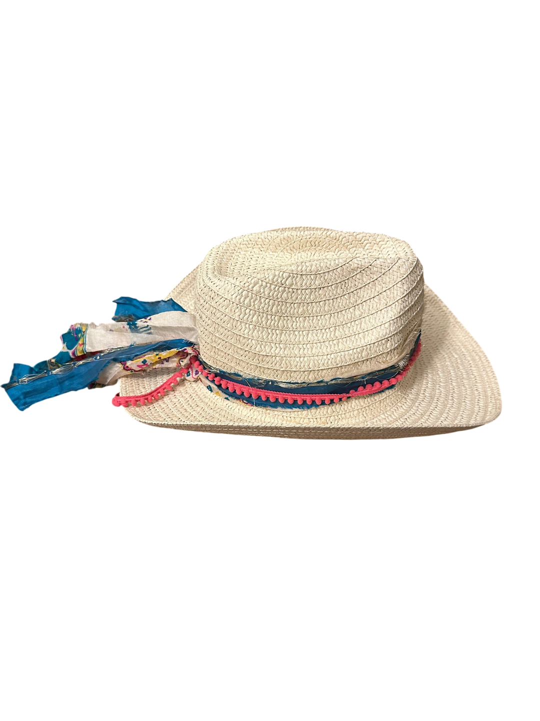 Adams + Hegwood woven straw Western hat with a blue patterned fabric band, pink pom-pom trim, and floral detail.