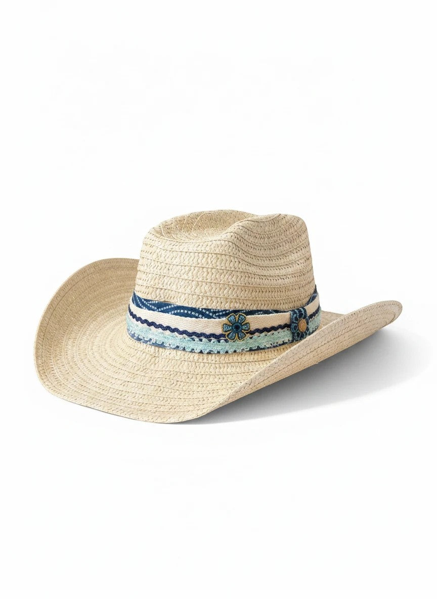 Adams + Hegwood woven straw western sun hat with a blue patterned fabric band, crochet trim, and floral accent.