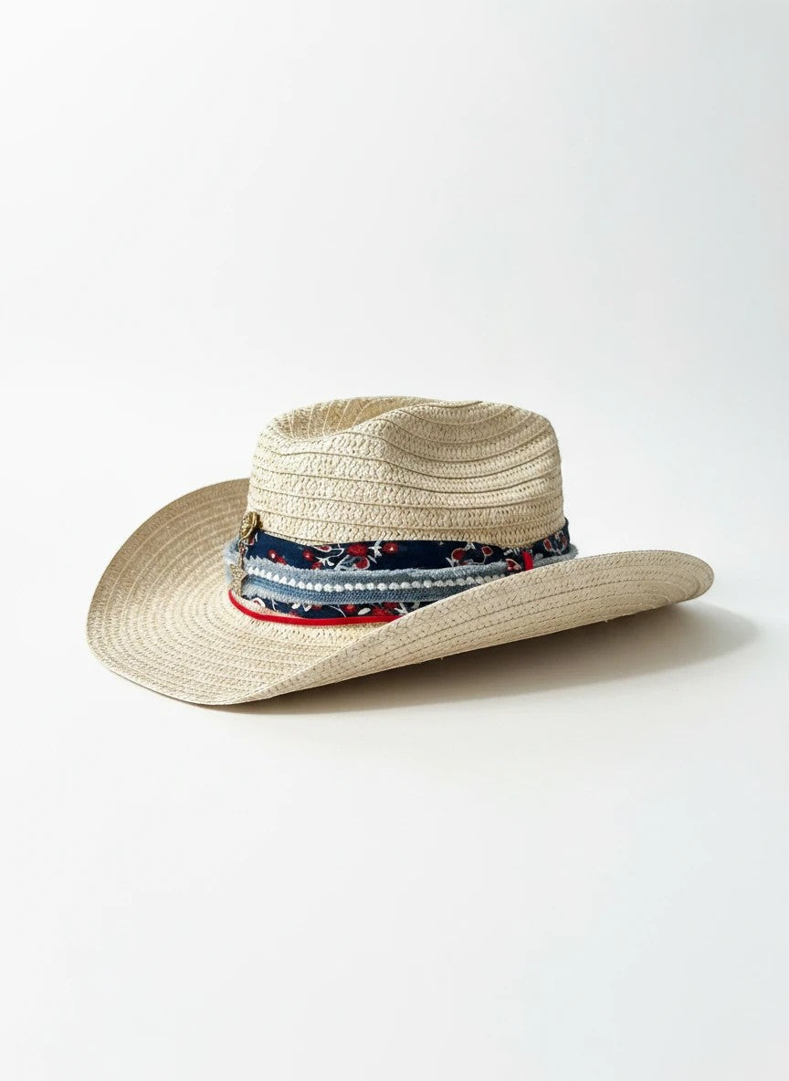 Adams + Hegwood woven straw western hat with a multi-layered floral band, red trim, and metallic star charm.