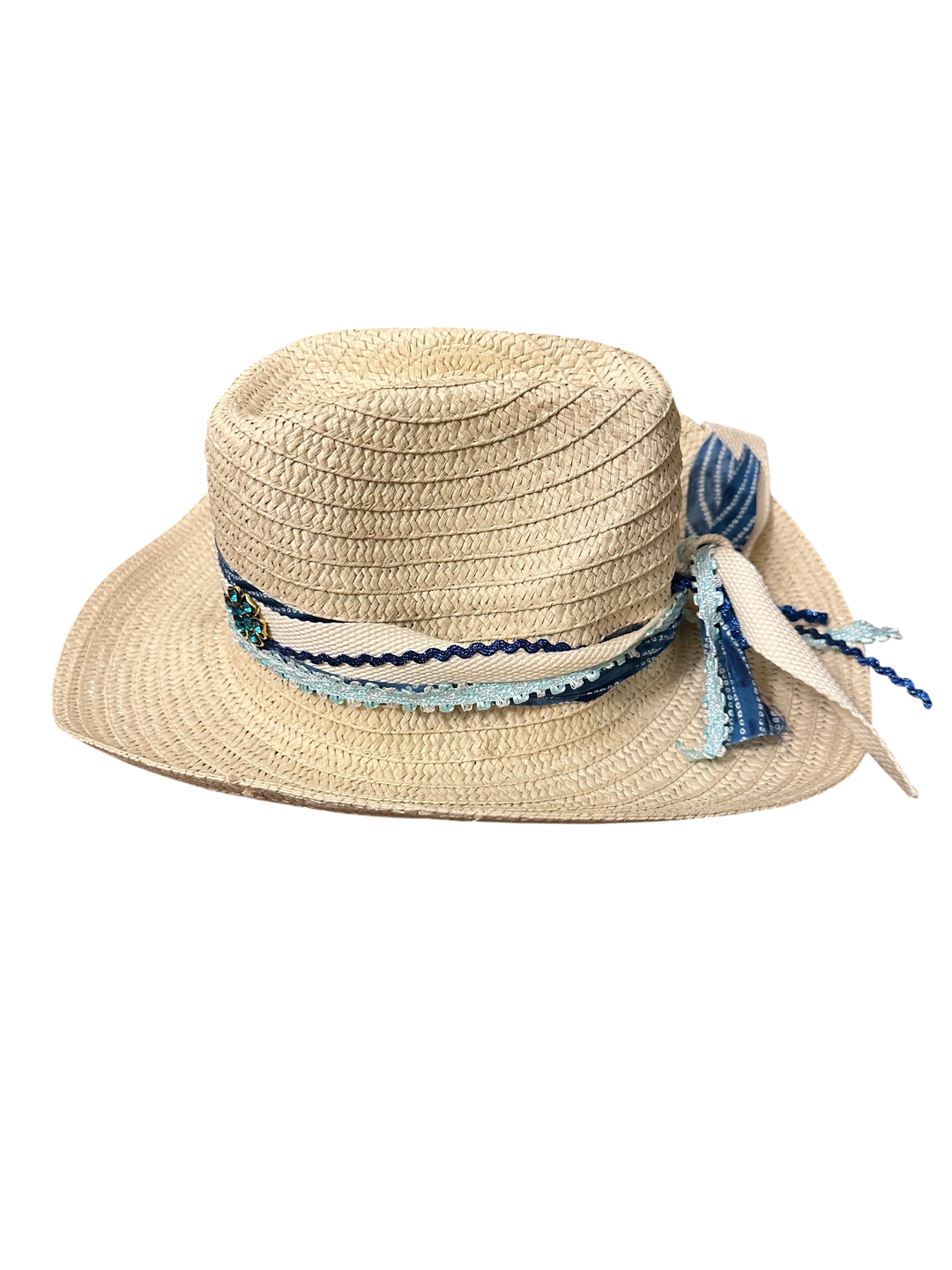 Adams + Hegwood woven straw western sun hat with blue patterned ribbon, crochet trim, and floral accent.
