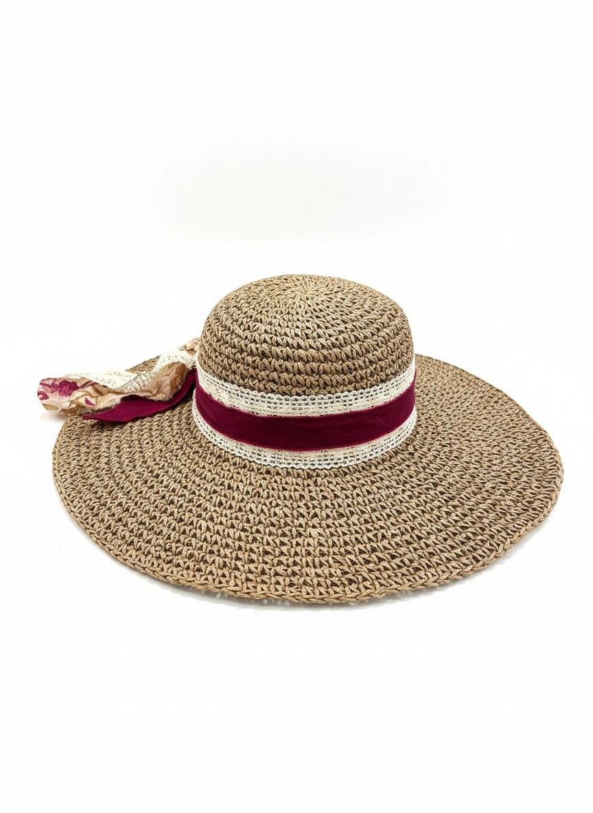 Adams + Hegwood woven wide brim sun hat with burgundy ribbon, lace trim, floral fabric, and faux pearls.