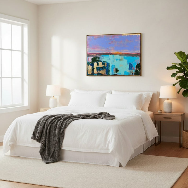 Natalie Adams Hegwood Studio abstract painting with gold leaf, cobalt, and coral above a modern white bedroom bed.