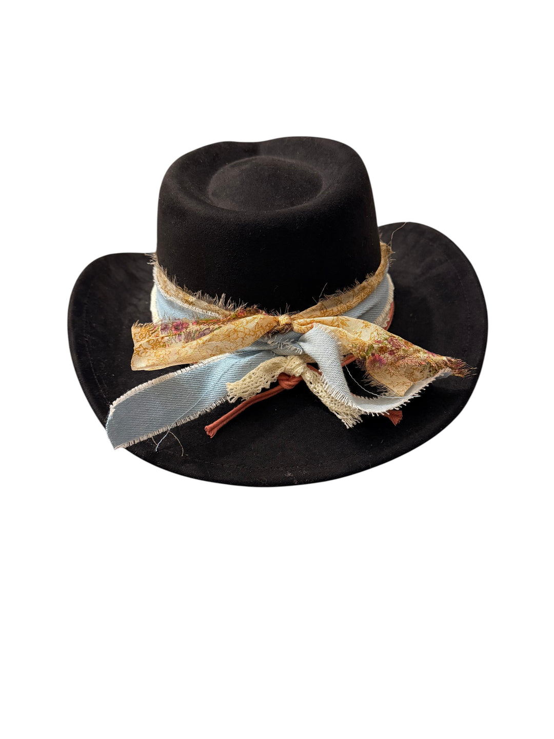 Natalie Adams Hegwood Studio black suede hat featuring a decorative frayed fabric tie with floral and blue accents.