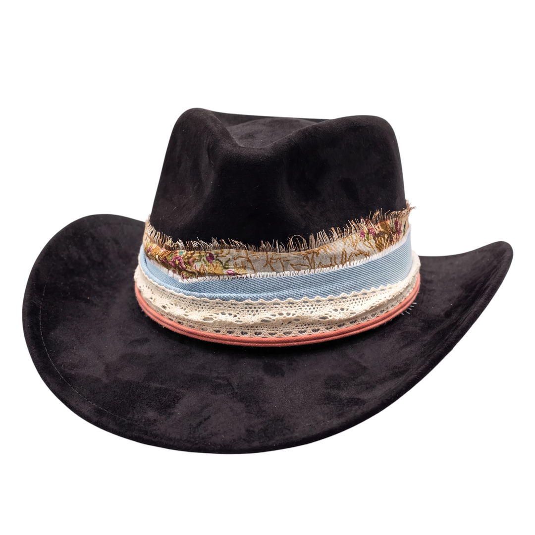 Natalie Adams Hegwood Studio black suede hat featuring a decorative layered ribbon and lace band with frayed edges.