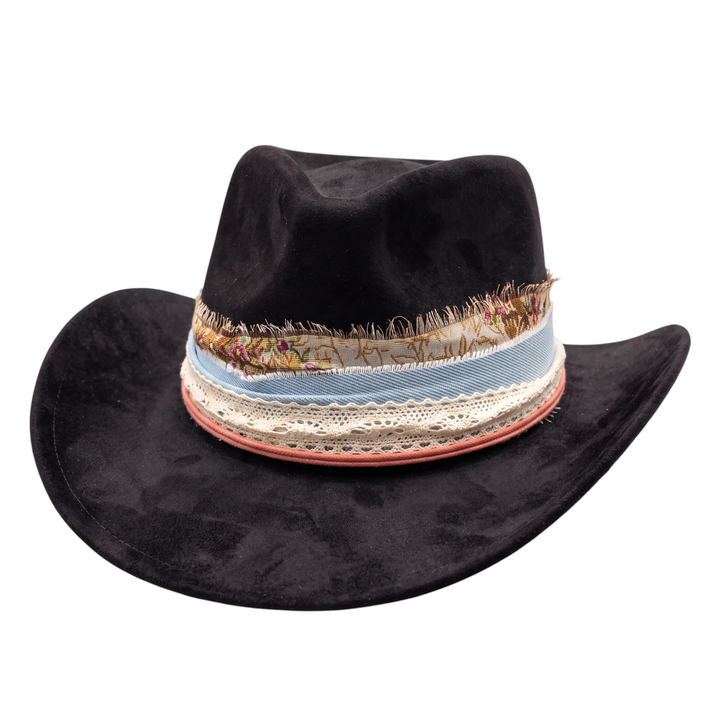 Natalie Adams Hegwood Studio black suede hat featuring a decorative layered ribbon and lace band with frayed edges.