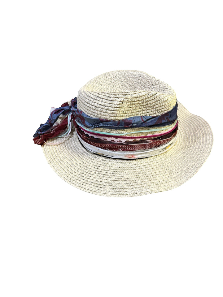 Natalie Adams Hegwood Studio wide brim straw hat with layered fabric ribbons, vintage trims, and feather accents.
