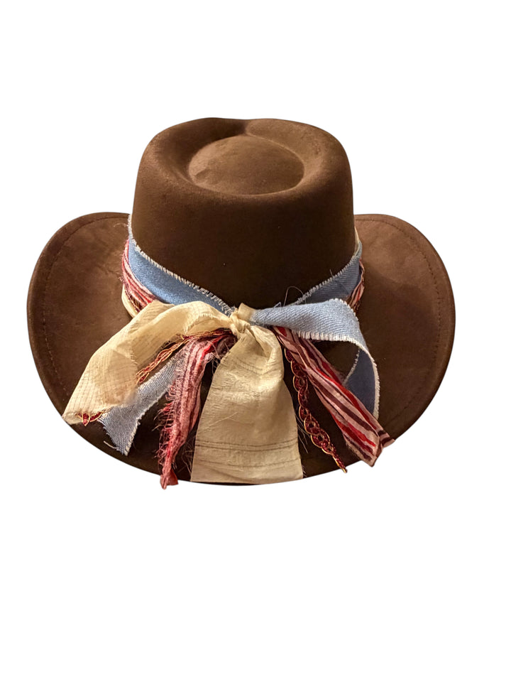 Natalie Adams Hegwood Studio brown suede cowgirl hat with a decorative hand-applied frayed fabric statement band.