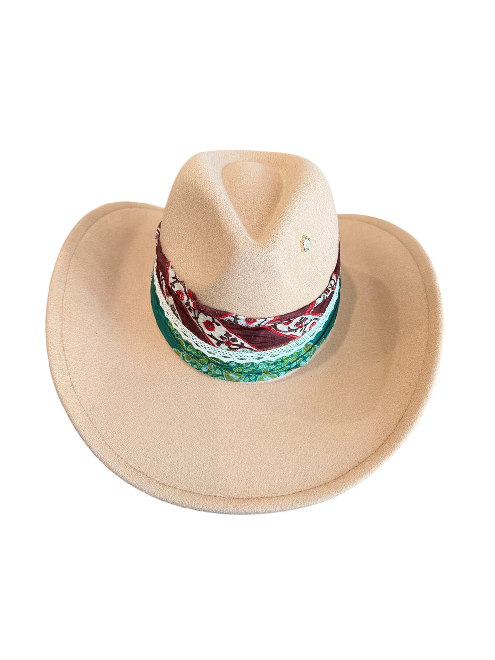 Natalie Adams Hegwood Studio camel felt western hat with a wide brim, floral band, emerald ribbon, and pearl pin.