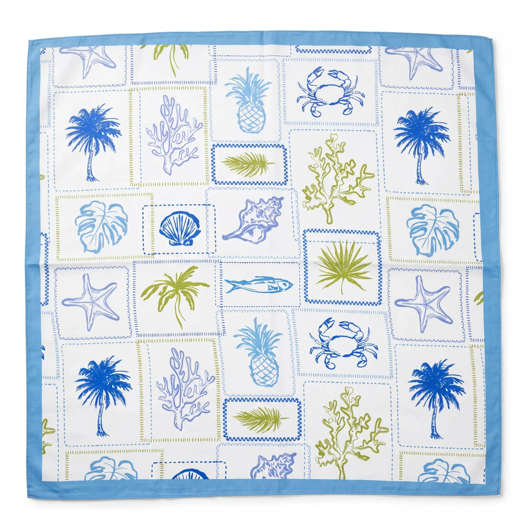 Square scarf with blue and green marine motifs including palm trees and starfish on a white background with a blue border.