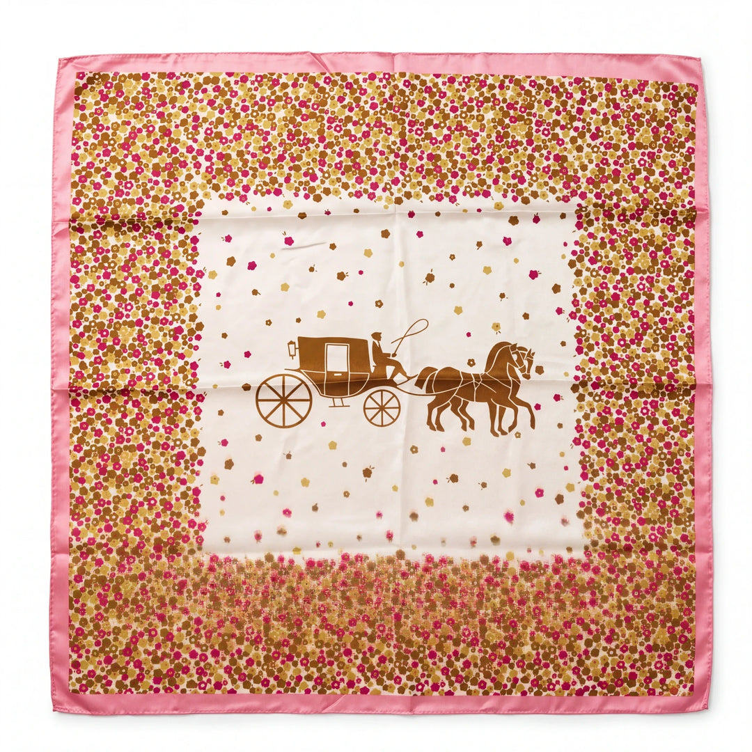A square scarf with an equestrian carriage motif surrounded by a pink and brown floral border on a cream background.