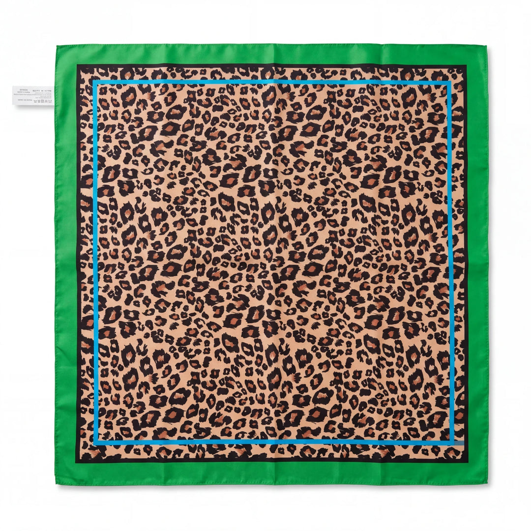 Natalie Adams Hegwood Studio square silk scarf with leopard print, bright green border, and blue accent line.