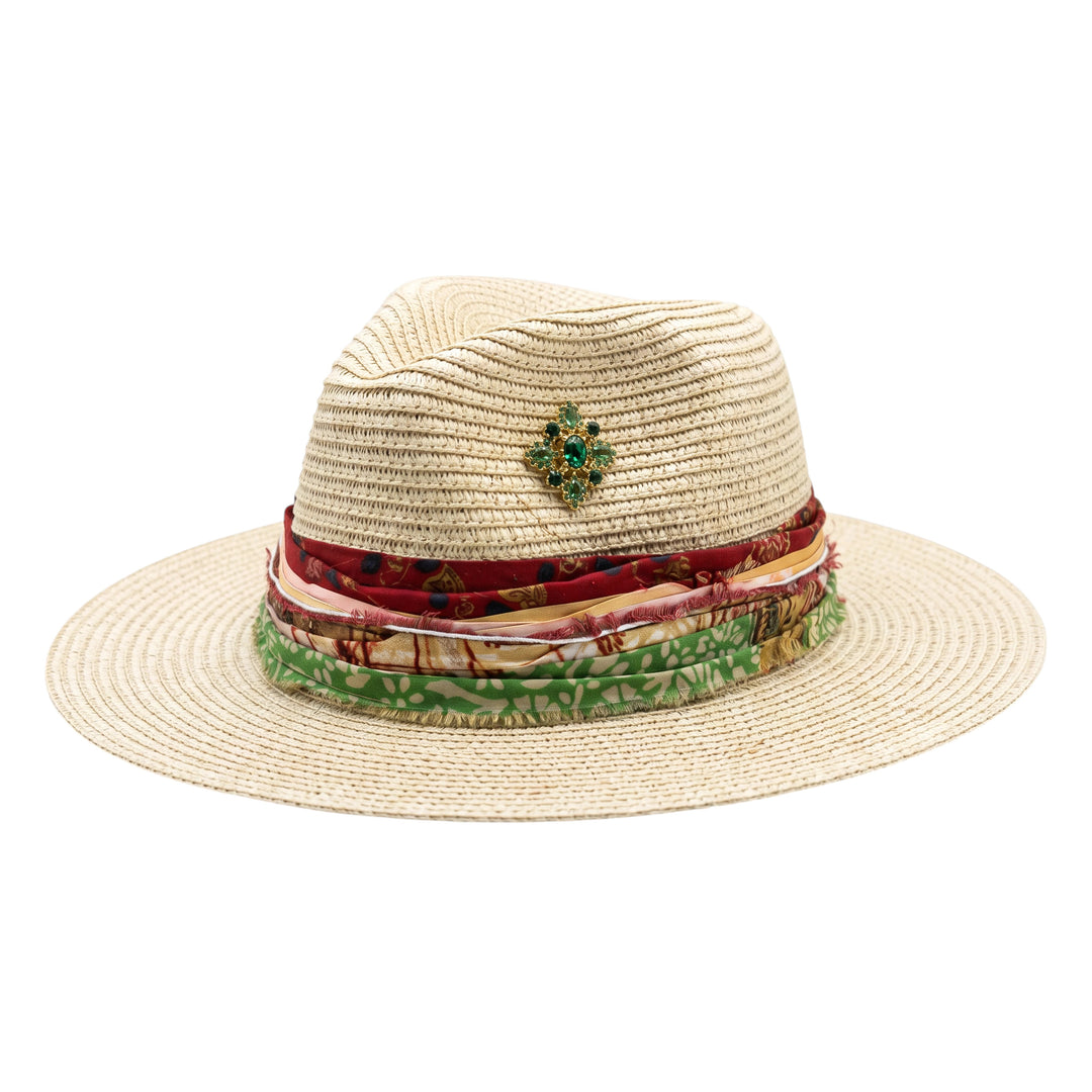 Natalie Adams Hegwood Studio straw fedora with a vibrant multi-layered fabric band and a green jewel embellishment.