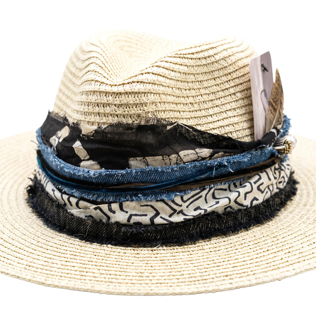 Natalie Adams Hegwood Studio woven straw fedora with layered denim and patterned fabric trim and feather detail.