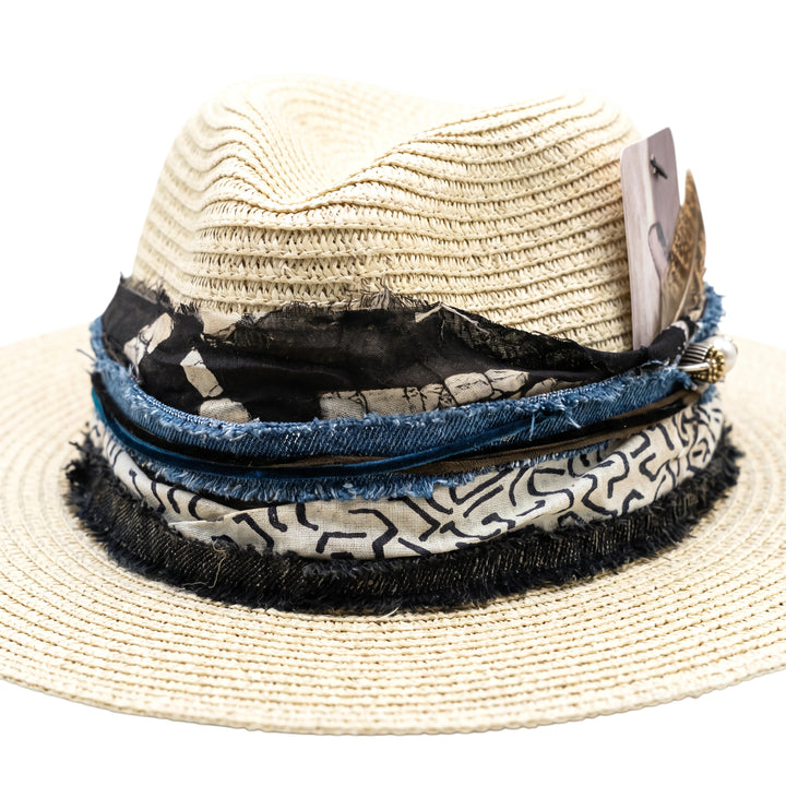 Natalie Adams Hegwood Studio woven straw fedora with layered denim and patterned fabric trim and feather detail.