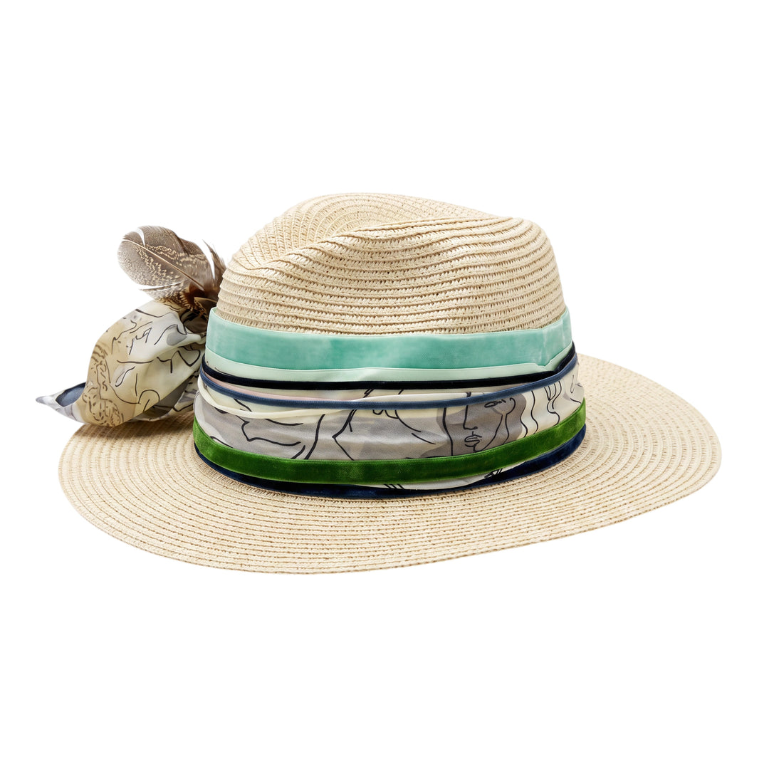 Natalie Adams Hegwood Studio wide brim straw fedora with green ribbon, patterned scarf tie, and feather accent.