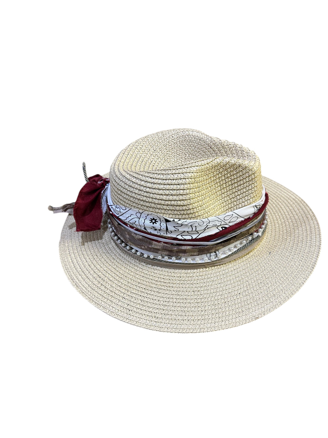 Natalie Adams Hegwood Studio straw fedora with a decorative band featuring fabric, pearls, and a feather accent.
