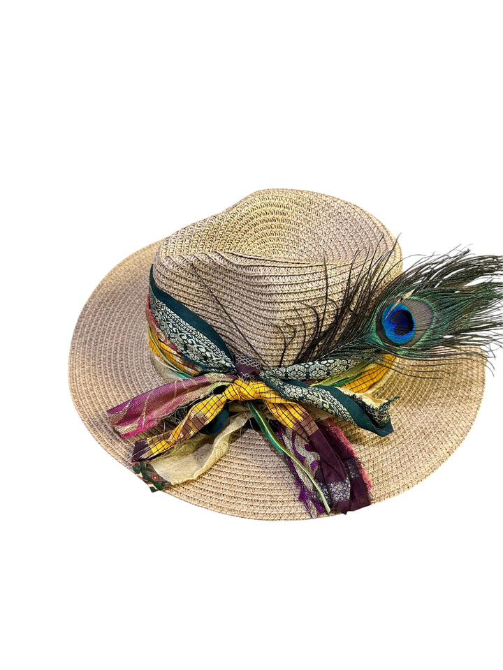 Natalie Adams Hegwood Studio straw fedora with a wide brim, featuring a colorful ribbon trim and a peacock feather accent.