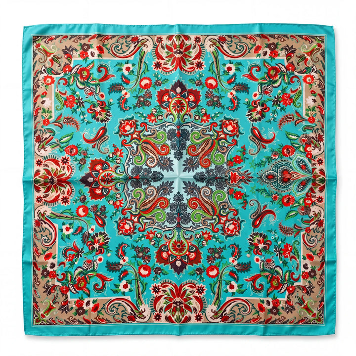 Natalie Adams Hegwood Studio square silk scarf featuring a vibrant teal, red, and neutral floral paisley pattern.